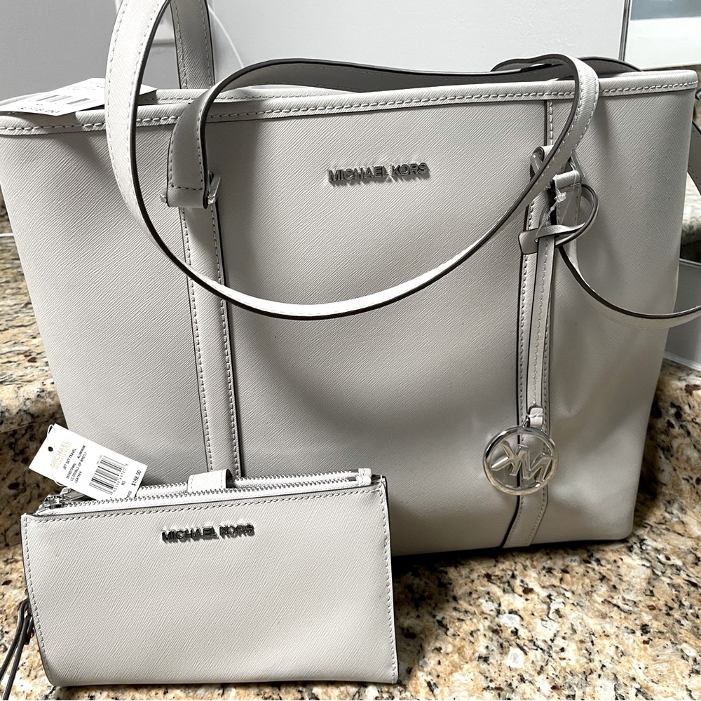 Michael Kors. New with tags Sady bag and wristlet